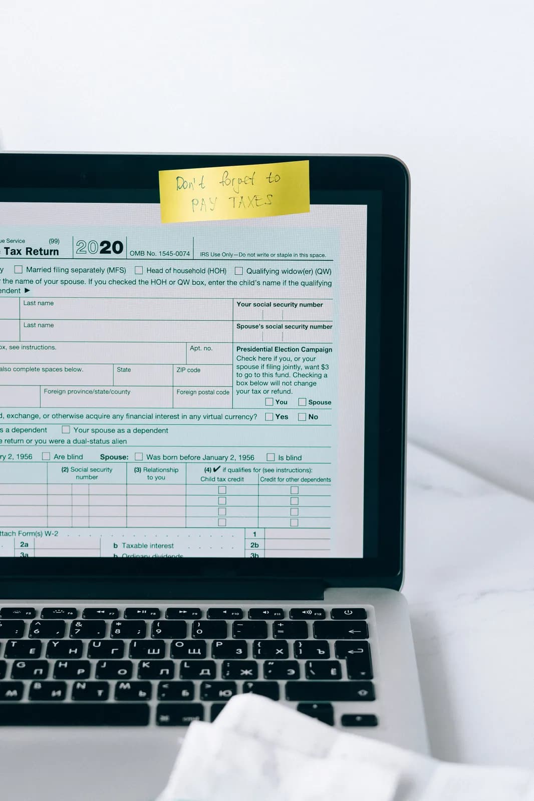 A tax return form open on a laptop screen